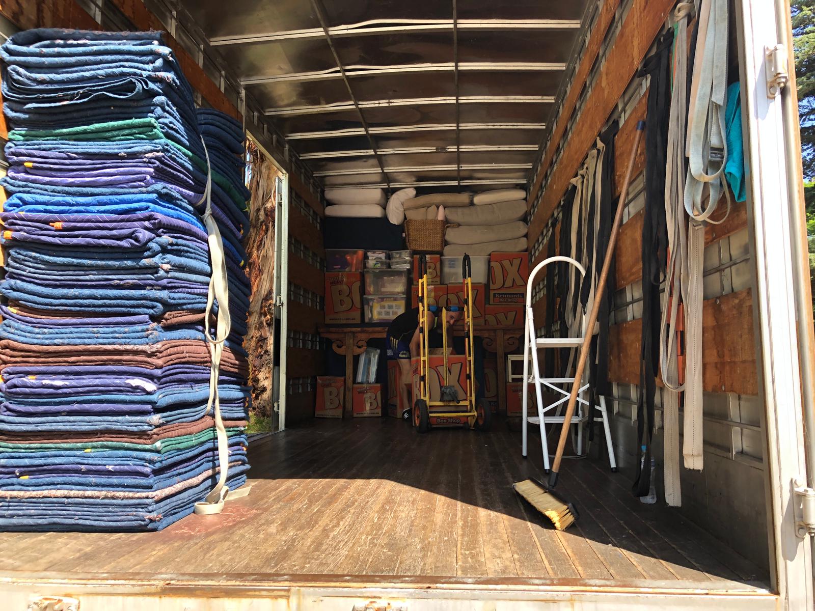 Removalists packing boxes for a move