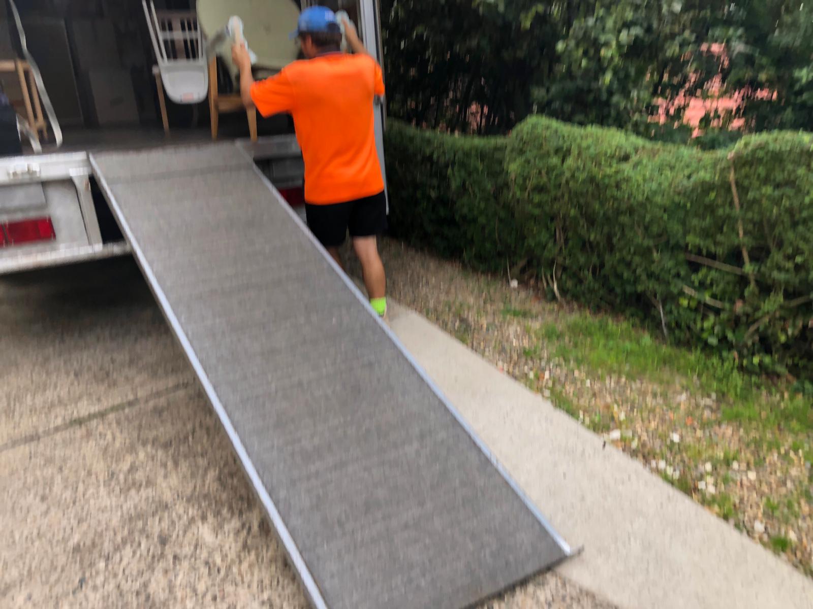 Removalists wrapping and protecting items